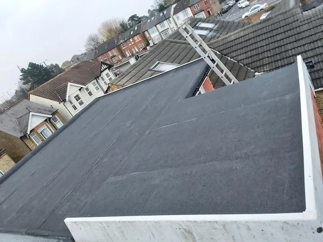 Dark felt flat roof with white perimeter trims